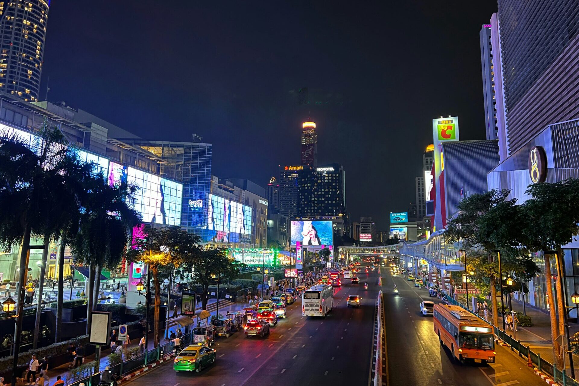 CentralWorld Bangkok night view at Ratchaprasong intersection with traffic, city lights, and busy shopping district