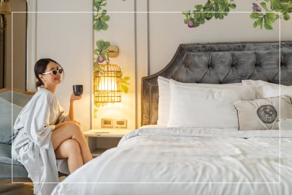Woman relaxing in a hotel suite during a girls getaway in Sukhumvit Bangkok